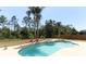 Inviting backyard pool and spa featuring lush landscaping and privacy fence at 3200 Town And Country Rd, Oviedo, FL 32766