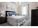 Inviting bedroom with a cozy bed, soft lighting, and stylish decor for a restful retreat at 3285 Songbird Cir, Harmony, FL 34773