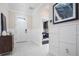 Welcoming home entryway with white wainscoting, tile flooring, and a view into the living space at 3285 Songbird Cir, Harmony, FL 34773