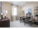 Bright home office features a writing desk, ample natural light, and stylish decorative touches at 3285 Songbird Cir, Harmony, FL 34773