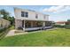 Exterior of home featuring a screened porch and green backyard at 343 Grand Royal Cir, Winter Garden, FL 34787