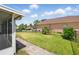 Manicured backyard featuring a brick path and secure fencing at 343 Grand Royal Cir, Winter Garden, FL 34787