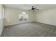 Spacious carpeted bedroom featuring a ceiling fan and one window at 343 Grand Royal Cir, Winter Garden, FL 34787