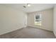 Bright bedroom with neutral carpet, natural light, and a window with views of the street at 343 Grand Royal Cir, Winter Garden, FL 34787