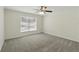 An empty bedroom offering neutral carpet, white walls, a ceiling fan, and a window at 343 Grand Royal Cir, Winter Garden, FL 34787