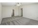 Carpeted bedroom with ceiling fan and arched entryway at 343 Grand Royal Cir, Winter Garden, FL 34787
