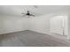 Spacious carpeted bedroom featuring a ceiling fan and interior door at 343 Grand Royal Cir, Winter Garden, FL 34787