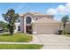 Charming two-story home featuring a two-car garage and well-maintained landscaping at 343 Grand Royal Cir, Winter Garden, FL 34787