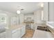 Bright kitchen featuring an island, white appliances, tile floor and eating area at 343 Grand Royal Cir, Winter Garden, FL 34787