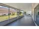 View of the spacious screened porch with painted concrete floors overlooking the backyard at 343 Grand Royal Cir, Winter Garden, FL 34787