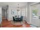 Cozy breakfast nook with pool view, hardwood floors, and a chandelier at 3535 Lake Sarah Dr, Orlando, FL 32804