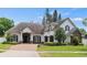 Charming single-story home with a beautiful brick driveway and a well-manicured front yard at 3535 Lake Sarah Dr, Orlando, FL 32804