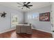 Bright home office with a wooden desk, and plantation shutters allowing for a focused work environment at 3535 Lake Sarah Dr, Orlando, FL 32804