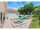 Beautiful backyard with a pool, spa, patio, and lush landscaping at 3535 Lake Sarah Dr, Orlando, FL 32804