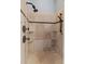 Modern walk-in shower featuring stylish tile work, recessed shelving, and dual shower heads at 3535 Lake Sarah Dr, Orlando, FL 32804