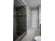 Stunning bathroom with gray-tiled shower, rain shower head, and blue glass accents at 36019 Clear Lake Dr, Eustis, FL 32736