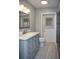 Beautiful bathroom featuring gray vanity with marble countertop and tile floors at 36019 Clear Lake Dr, Eustis, FL 32736