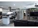 Modern kitchen featuring stainless appliances, white cabinetry, and a center island with barstool seating at 36019 Clear Lake Dr, Eustis, FL 32736