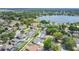 Aerial view of neighborhood featuring waterfront property, pools and well-maintained lawns at 3713 Dover St, Orlando, FL 32806