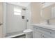 Modern bathroom featuring sleek tiling, a rain shower head, and a stylish vanity at 3713 Dover St, Orlando, FL 32806