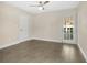 Bright bedroom with tiled floors and a glass door leading to the back, offering a welcoming space at 3713 Dover St, Orlando, FL 32806