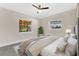 Bright bedroom featuring neutral decor, hardwood floors, large windows, and a ceiling fan at 3713 Dover St, Orlando, FL 32806