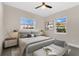 Cozy bedroom with hardwood floors, recessed lighting, ceiling fan, and two windows at 3713 Dover St, Orlando, FL 32806