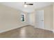 Neutral bedroom with stylish flooring, ceiling fan, and two closets providing ample storage space at 3713 Dover St, Orlando, FL 32806