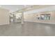 Spacious open-concept living area with recessed lighting, tile flooring, and a modern kitchen at 3713 Dover St, Orlando, FL 32806