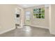 Inviting living room featuring a window view and an open doorway to the kitchen at 3713 Dover St, Orlando, FL 32806