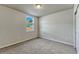 Bedroom with neutral colored walls, window and carpet at 439 Sarah Nicole Way, New Smyrna Beach, FL 32168