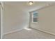 This bedroom is well lit and features neutral colored carpet and walls at 439 Sarah Nicole Way, New Smyrna Beach, FL 32168