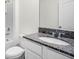 Bathroom featuring a granite vanity countertop, white cabinets, and a shower-tub combination at 4497 Yaupon Holly Way, Lakeland, FL 33811