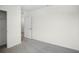 Bedroom features neutral carpet, closet with a door, and a door to the hallway at 4497 Yaupon Holly Way, Lakeland, FL 33811