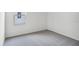 Bedroom features neutral carpet and a window at 4497 Yaupon Holly Way, Lakeland, FL 33811