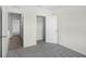 A spare bedroom provides plush carpeting, closet space and easy access to the bathroom at 4497 Yaupon Holly Way, Lakeland, FL 33811