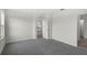 Spacious bedroom with carpet flooring and ample natural light at 4497 Yaupon Holly Way, Lakeland, FL 33811