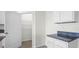 Bright kitchen features granite countertops, white cabinetry, and an open pantry for easy access at 4497 Yaupon Holly Way, Lakeland, FL 33811