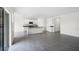 Open floor plan showcasing a kitchen with stainless steel appliances, granite counters, and a large island at 4497 Yaupon Holly Way, Lakeland, FL 33811