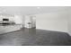 Spacious open concept living room into the kitchen; featuring tile floors and stainless steel appliances at 4497 Yaupon Holly Way, Lakeland, FL 33811