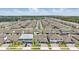 A stunning aerial view of a well-planned community with lush landscaping and modern homes at 4779 Cragmere Loop, Clermont, FL 34711