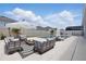 The backyard has a patio, a pool, outdoor furniture and a white privacy fence at 4779 Cragmere Loop, Clermont, FL 34711