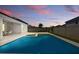 Inviting pool area with landscaping, fencing, and a covered patio for outdoor enjoyment at 4779 Cragmere Loop, Clermont, FL 34711