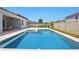 The backyard features a beautiful pool and patio for relaxation at 4779 Cragmere Loop, Clermont, FL 34711