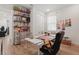 Well lit bedroom, great for an office or craft room, with custom shelving and wood-look floors at 4779 Cragmere Loop, Clermont, FL 34711