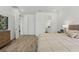 Cozy bedroom featuring wood-look tile, soft lighting, and a peaceful atmosphere at 4779 Cragmere Loop, Clermont, FL 34711