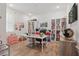 Spacious, naturally lit bedroom with white shelving, wood-look flooring, and a decorative theme at 4779 Cragmere Loop, Clermont, FL 34711