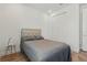 Cozy bedroom featuring wood floors, a queen size bed, and a closet at 4779 Cragmere Loop, Clermont, FL 34711