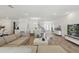 Spacious open-concept living area with kitchen and dining space, ample seating, and elegant décor at 4779 Cragmere Loop, Clermont, FL 34711