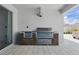 A new outdoor kitchen with a built-in grill and stone surround at 4779 Cragmere Loop, Clermont, FL 34711